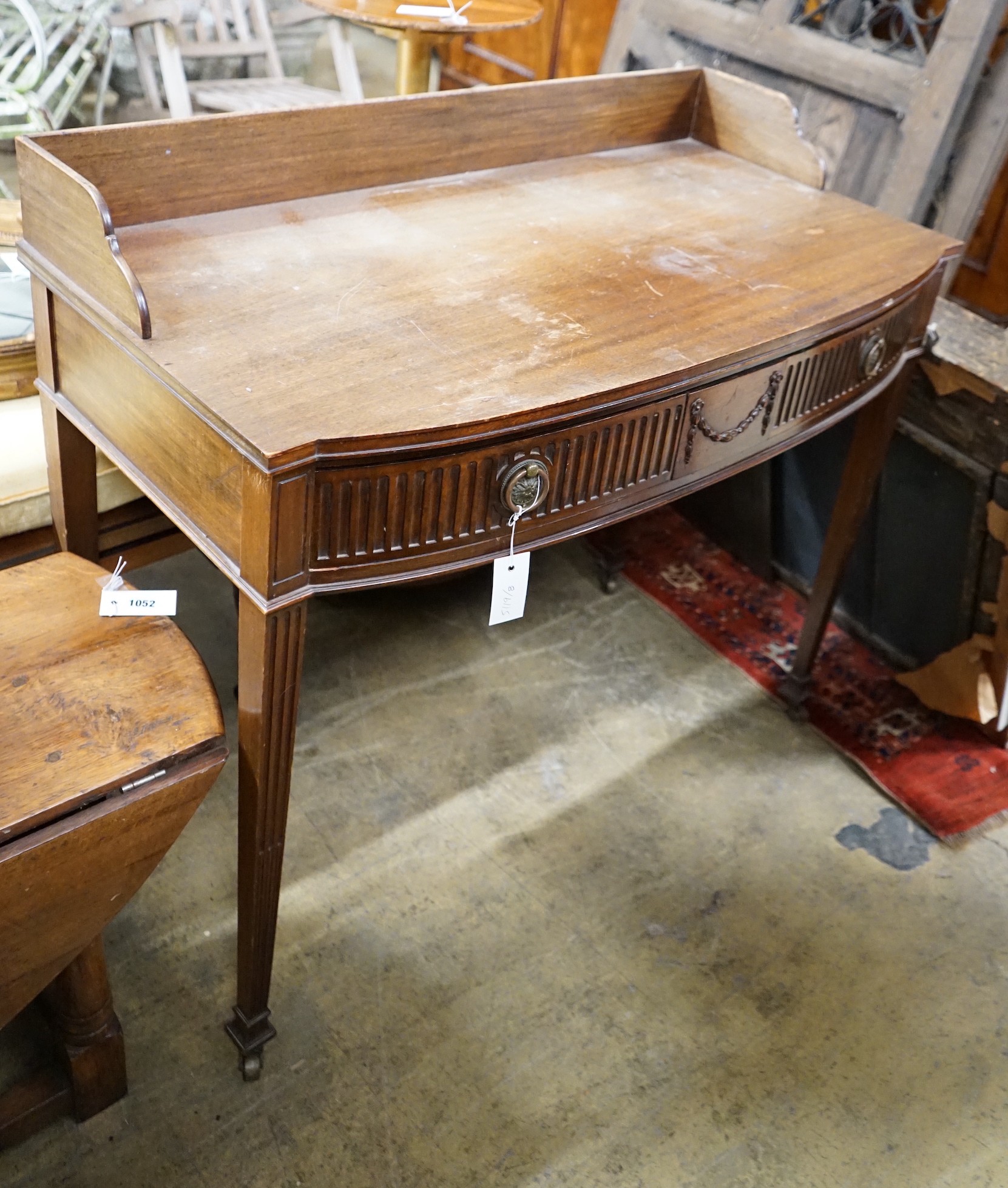 An Edwardian Chippendale revival mahogany bowfront wash stand, width 99cm, depth 50cm, height 88cm